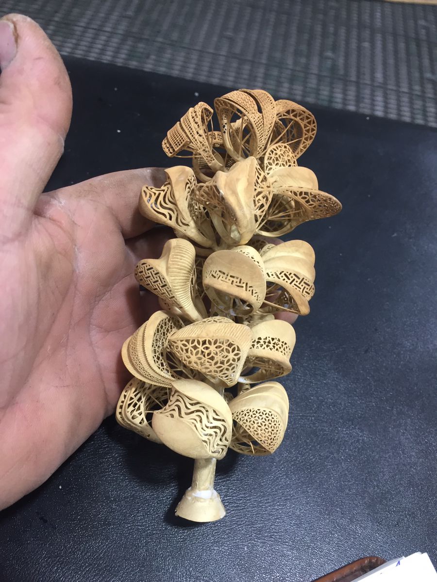 Gold jewelry casting result — raw cast ring before finishing